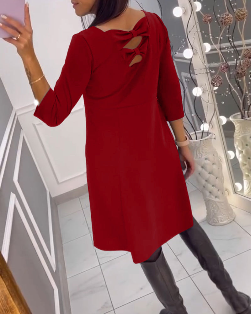 Solid color dress with bow at back