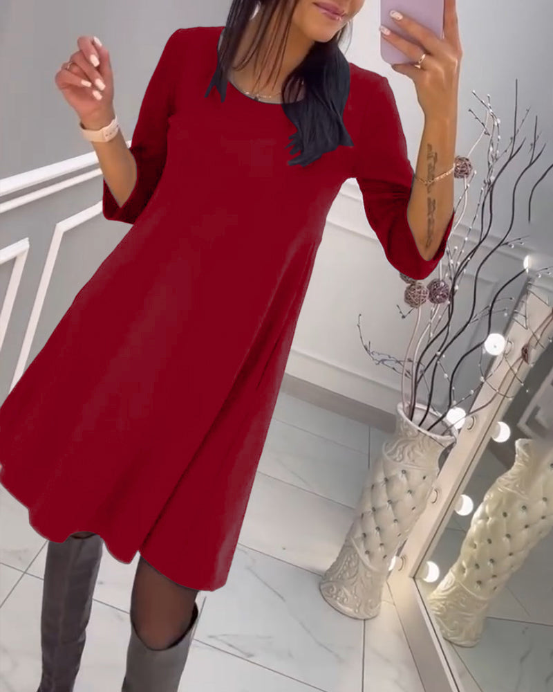 Solid color dress with bow at back