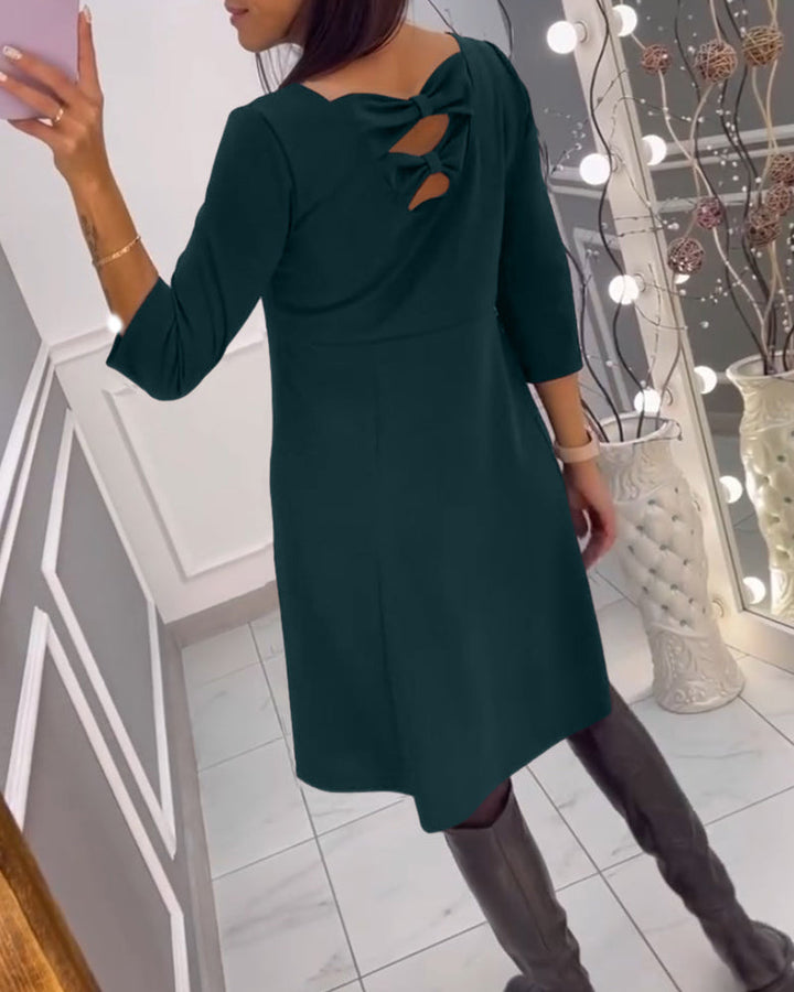 Solid color dress with bow at back