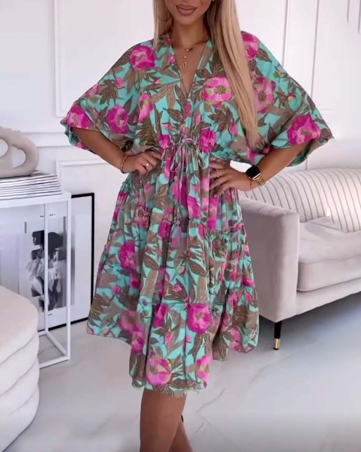 Elegant dress with drawstring ties and floral print