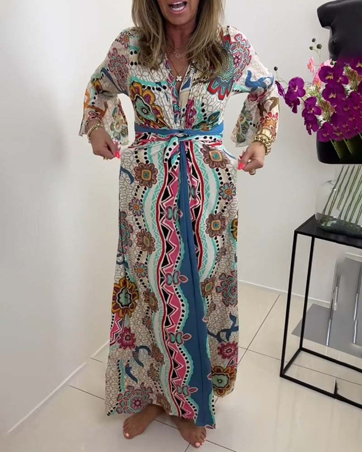 Elegant dress with colorful print and bell sleeves