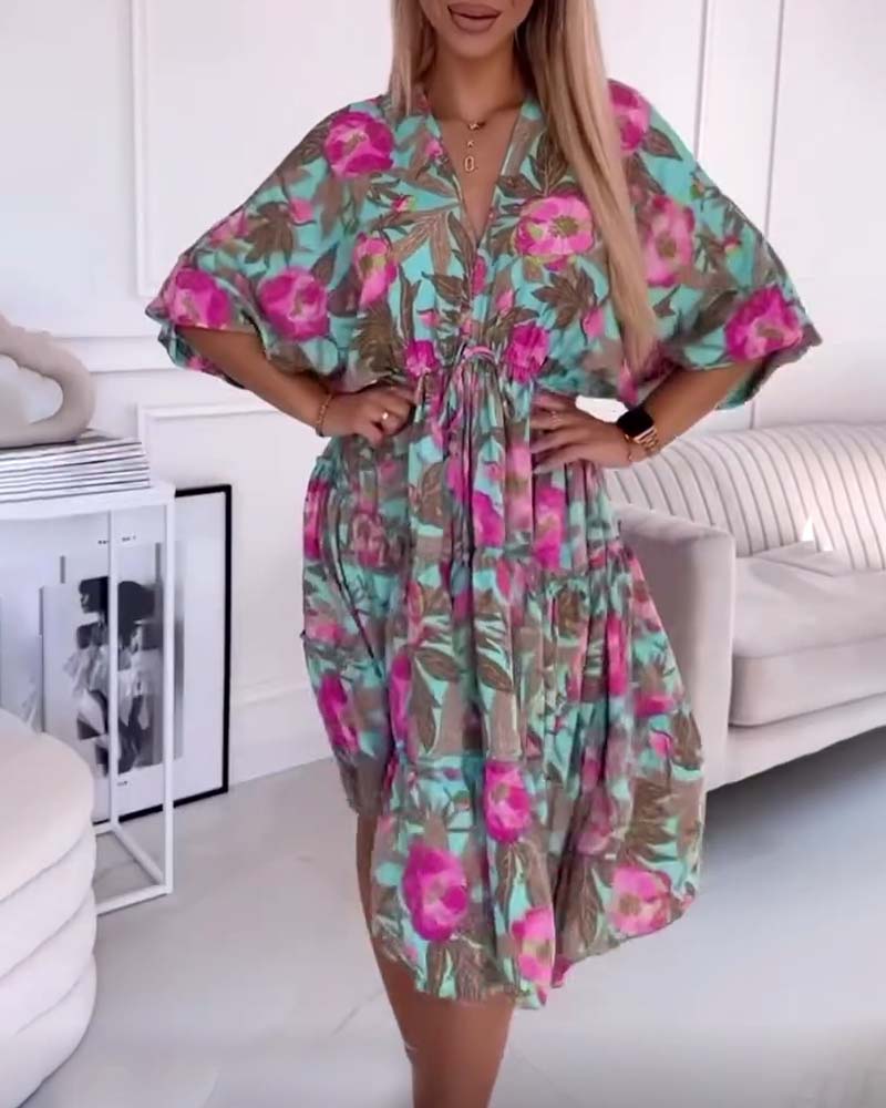 Elegant dress with drawstring ties and floral print