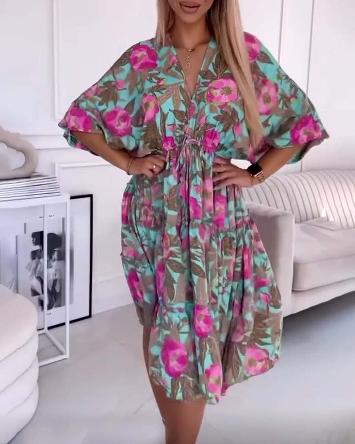 Elegant dress with drawstring ties and floral print