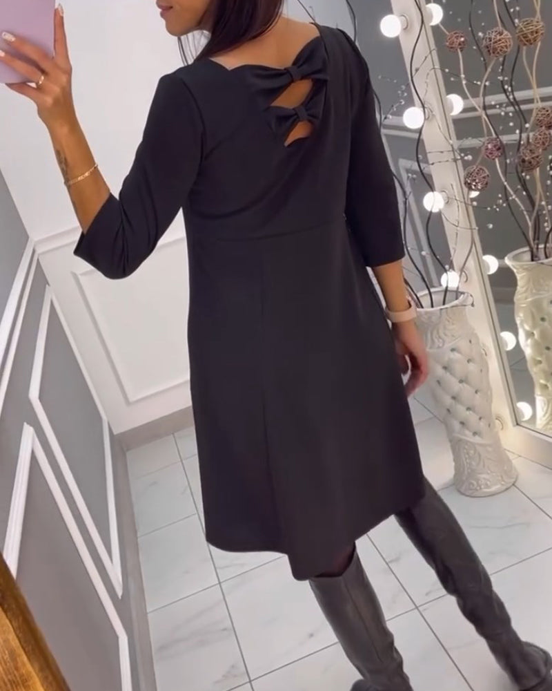 Solid color dress with bow at back